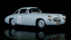 Light blue diecast vintage race car model with number 20, displayed on black background
