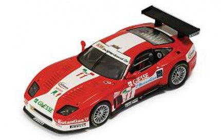Red and white diecast Ferrari race car model with detailed decals and large rear wing