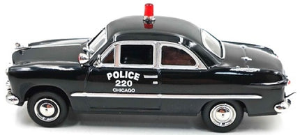 1:43 scale black 1949 Ford Custom diecast model car, police design with red siren, side view