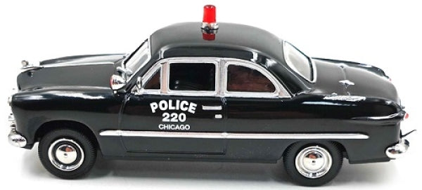 1:43 scale black 1949 Ford Custom diecast model car, police design with red siren, side view