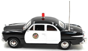 1949 black and white LAPD Ford diecast model police car with rooftop siren and antenna