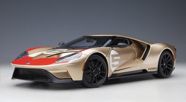 1:18 scale gold Ford GT 2022 diecast model car with black wheels and red accents