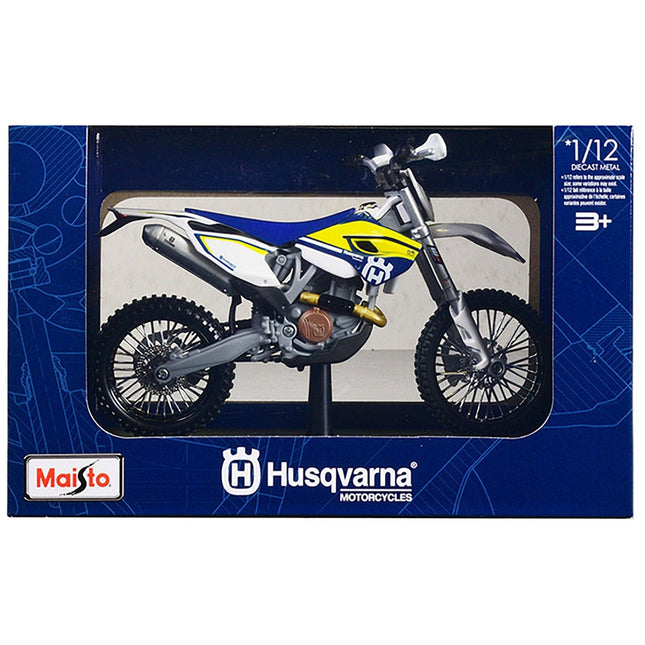 https://cdn.shopify.com/s/files/1/0504/9925/6496/files/husqvarna-fe-501-white-and-blue-with-yellow-stripes-112-diecast-motorcycle-model-by-maisto-783297.jpg?v=1760624522