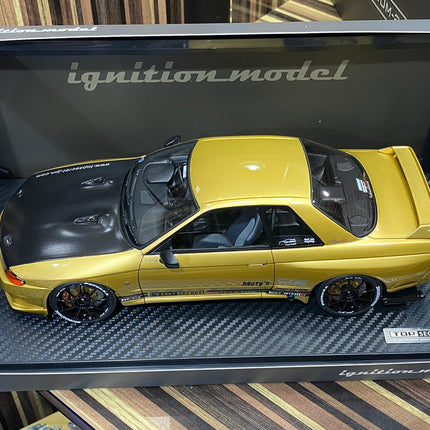 Ignition Model 1:18 Nissan Skyline GT-R R32 Gold Resin Model Car - studio product photo of the scale model