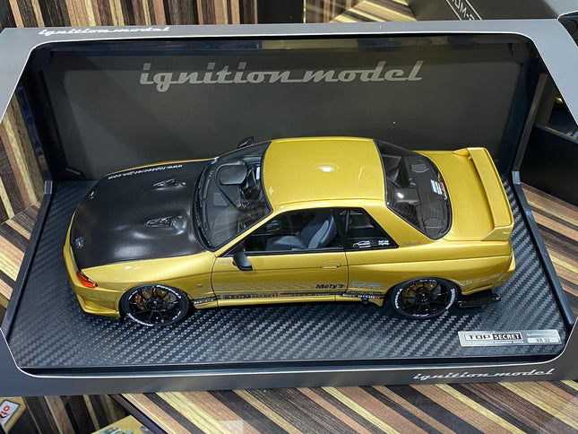 Ignition Model 1:18 Nissan Skyline GT-R R32 Gold Resin Model Car - studio product photo of the scale model