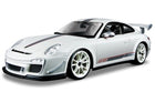 White 1:18 scale diecast Porsche model car with racing stripes and rear spoiler