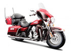 Red and black diecast touring motorcycle model with chrome details and windshield