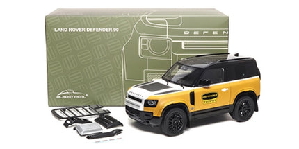 1:18 yellow Land Rover Defender 90 diecast model car with accessories and box