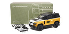 1:18 yellow Land Rover Defender 90 diecast model car with accessories and box