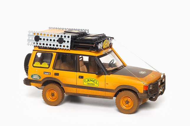 https://www.mydiecastcars.com/wp-content/uploads/2022/09/land-rover-discovery-camel-trophy-dirty-almost-real-1.jpg