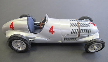 1:18 scale silver vintage race car diecast model with red number 4, open cockpit