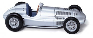 Silver classic diecast race car model with blue seat and detailed wheels, side view