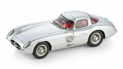 Silver diecast model car with red interior, classic coupe design, detailed wheels, collectible scale model