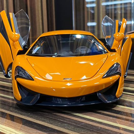 AutoArt McLaren 570S Orange 1:18 Diecast Model Car - studio product photo of the scale model