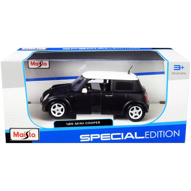 https://cdn.shopify.com/s/files/1/0504/9925/6496/files/mini-cooper-matt-black-with-white-top-124-diecast-model-car-by-maisto-508662.jpg?v=1748418507