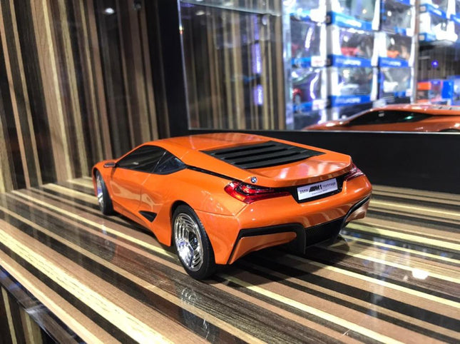 Minichamps 1/18 Resin BMW M1 Hommage Orange Model Car - studio product photo of the scale model