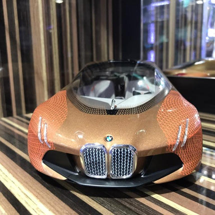 Minichamps 1/18 Resin BMW Vision Next 100 Bronze Orange - studio product photo of the scale model