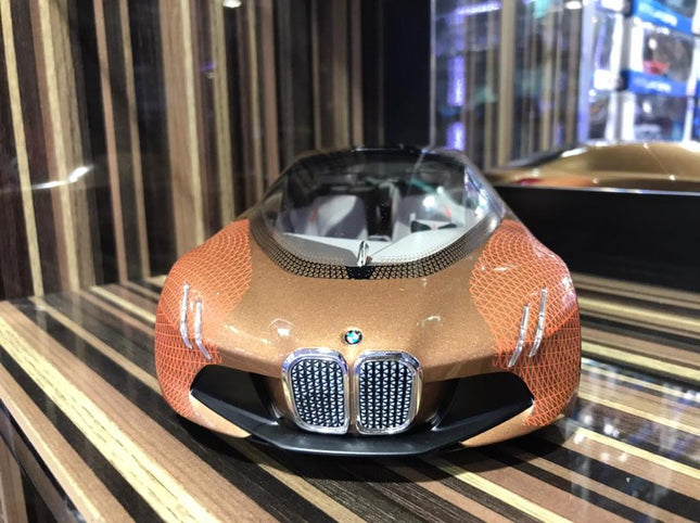 Minichamps 1/18 Resin BMW Vision Next 100 Bronze Orange - studio product photo of the scale model