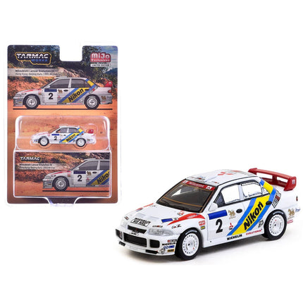 https://cdn.shopify.com/s/files/1/0504/9925/6496/files/mitsubishi-lancer-evolution-iii-2-kenneth-eriksson-staffan-parmander-winner-hong-kong-beijing-rally-1995-global64-series-164-diecast-model-by-tarmac-works-790789.jpg?v=1756087154
