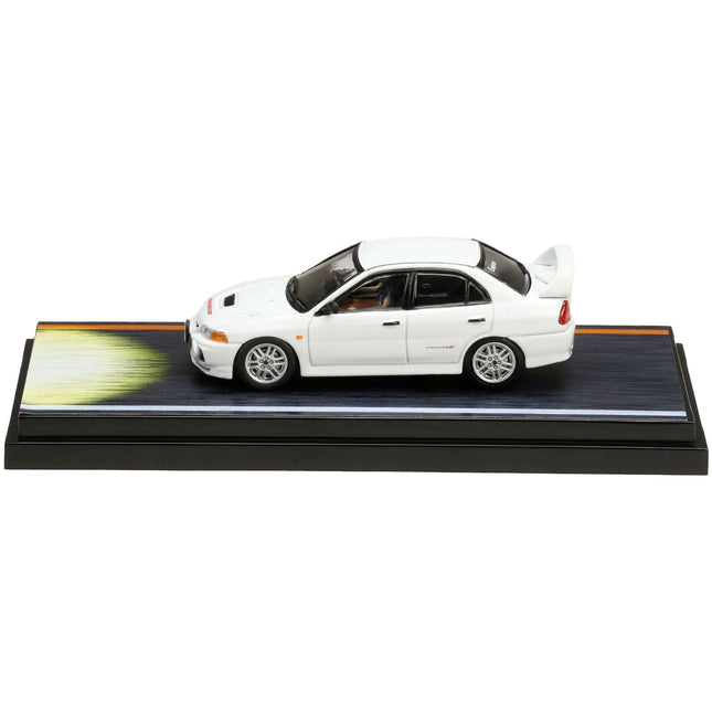 https://cdn.shopify.com/s/files/1/0504/9925/6496/files/mitsubishi-lancer-rs-evolution-iv-rhd-right-hand-drive-white-monstar-with-seiji-iwaki-driver-figure-initial-d-1995-2013-manga-164-diecast-model-car-by-hobby-jap-575048.jpg?v=1748404173