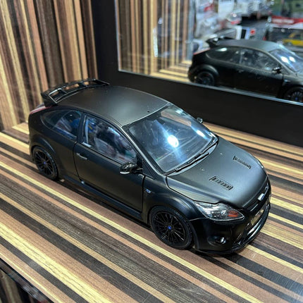Minichamps Ford Focus RS500 1/18 Diecast Model All Opening Matt Black - studio product photo of the scale model
