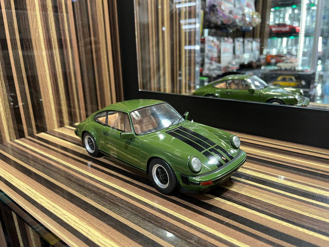 Solido Porsche 911 Carrera 1/18 Diecast Model Green Partial Opening - studio product photo of the scale model