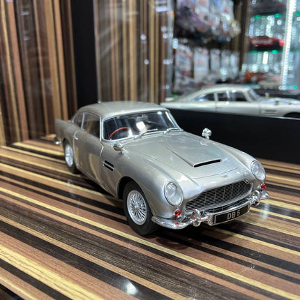 Solido Aston Martin DB5 - 1/18 Diecast Model, Partial Opening - Silver - studio product photo of the scale model