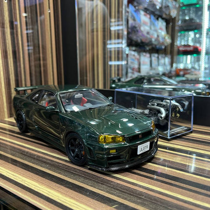 MotorHelix Nissan Skyline GT-R34 Nismo 1/18 Diecast Model Dark Green - studio product photo of the scale model