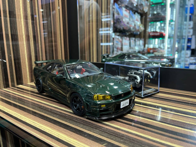 MotorHelix Nissan Skyline GT-R34 Nismo 1/18 Diecast Model Dark Green - studio product photo of the scale model