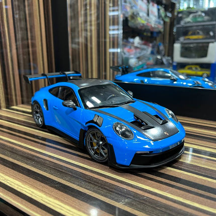 Minichamps Porsche GT3RS 1:18 Blue Diecast Model Car Partial Opening - studio product photo of the scale model