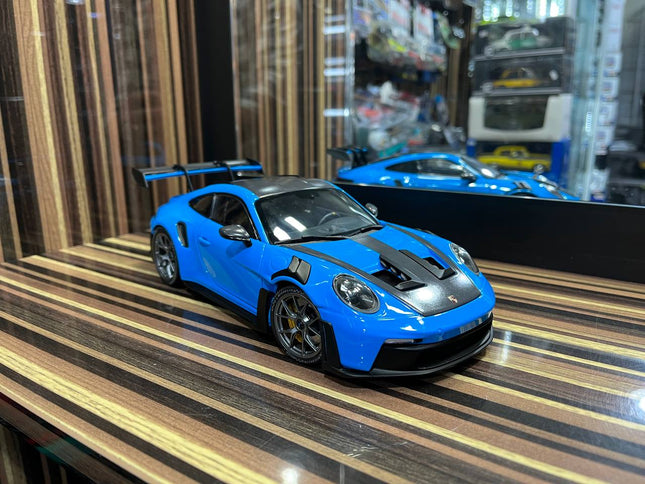 Minichamps Porsche GT3RS 1:18 Blue Diecast Model Car Partial Opening - studio product photo of the scale model