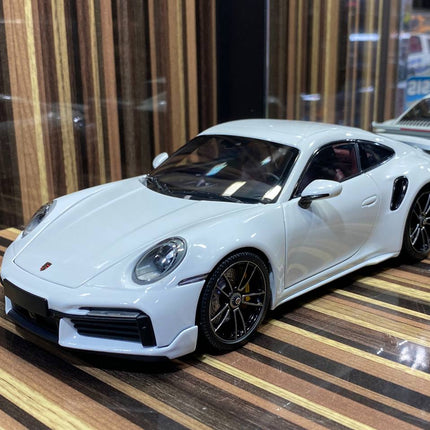 Minichamps 1/18 Porsche 911 Turbo S White All Opening Diecast Model - studio product photo of the scale model