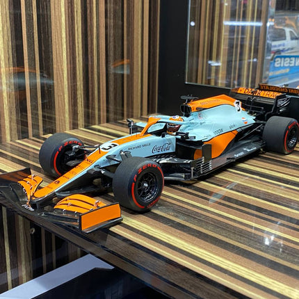 Minichamps 1/18 McLaren MCL35M Daniel Ricciardo Monaco GP 2021 Gulf - studio product photo of the scale model