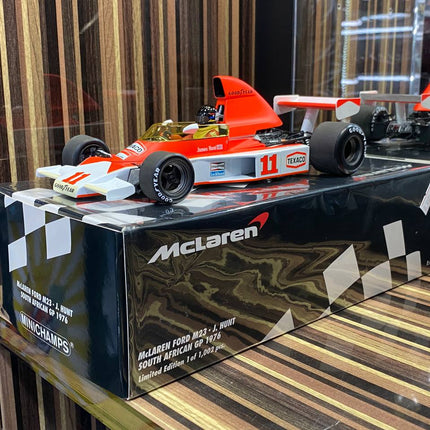 Minichamps McLaren Ford M23 #11 J. Hunt 1976 1/18 Diecast Model - studio product photo of the scale model