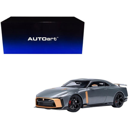 https://cdn.shopify.com/s/files/1/0504/9925/6496/files/nissan-gt-r50-by-italdesign-goodwood-version-liquid-kinetic-gray-metallic-with-gold-accents-118-model-car-by-autoart-247777.jpg?v=1756087277