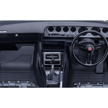 https://cdn.shopify.com/s/files/1/0504/9925/6496/files/nissan-skyline-2000gt-r-kpgc110-tuned-version-rhd-right-hand-drive-white-118-model-car-by-autoart-602047.jpg?v=1748403636