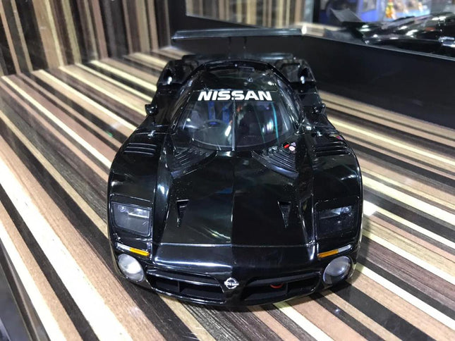 AutoArt Nissan R390 GTI 1998 Black 1:18 Diecast Model Car - studio product photo of the scale model