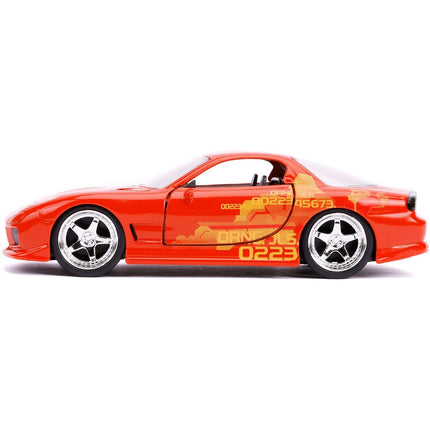 https://cdn.shopify.com/s/files/1/0504/9925/6496/files/orange-julius-mazda-rx-7-orange-metallic-with-graphics-fast-furious-series-132-diecast-model-car-by-jada-530595.jpg?v=1748419008