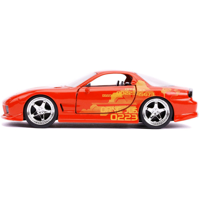 https://cdn.shopify.com/s/files/1/0504/9925/6496/files/orange-julius-mazda-rx-7-orange-metallic-with-graphics-fast-furious-series-132-diecast-model-car-by-jada-530595.jpg?v=1748419008