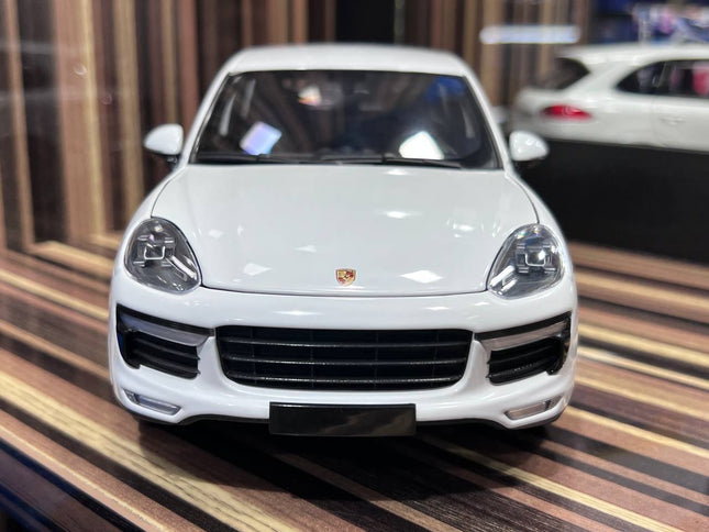 Minichamps 1/18 Porsche Cayenne White Diecast Model Car - studio product photo of the scale model