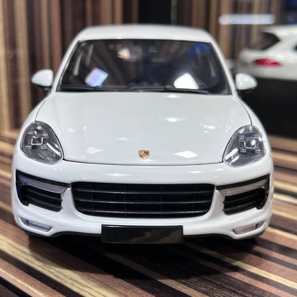 Minichamps 1/18 Porsche Cayenne White Diecast Model Car - studio product photo of the scale model