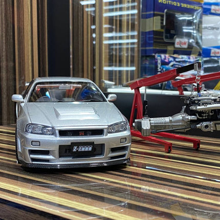 MotorHelix 1:18 Nissan Skyline GT-R R34 Nismo Z-Tune Silver Diecast Model - studio product photo of the scale model