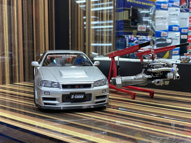 MotorHelix 1:18 Nissan Skyline GT-R R34 Nismo Z-Tune Silver Diecast Model - studio product photo of the scale model
