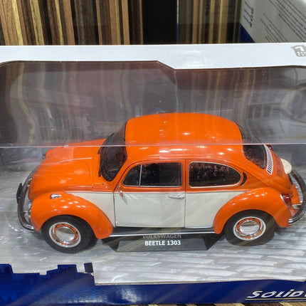 Solido 1:18 Volkswagen Beetle 1303 Orange Resin Model Car - studio product photo of the scale model