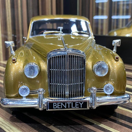 Minichamps 1/18 Bentley S2 1960 Gold Diecast Model Car - studio product photo of the scale model