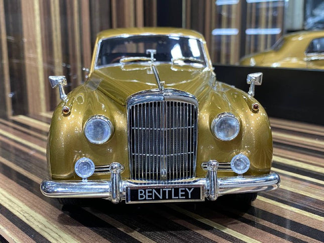 Minichamps 1/18 Bentley S2 1960 Gold Diecast Model Car - studio product photo of the scale model