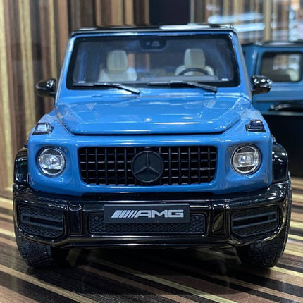 Minichamps 1/18 Mercedes-Benz G 63 AMG Blue Diecast Model Car - studio product photo of the scale model