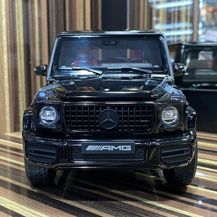 Minichamps Mercedes-Benz G 63 AMG 1:18 Diecast Model Car Black - studio product photo of the scale model
