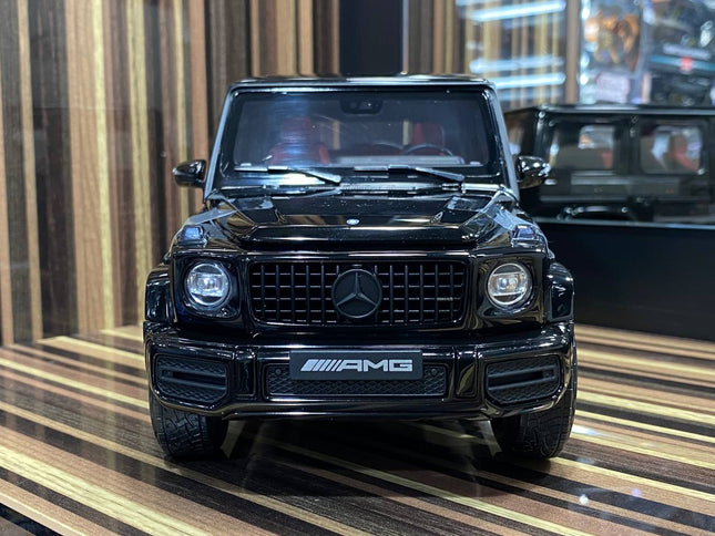 Minichamps Mercedes-Benz G 63 AMG 1:18 Diecast Model Car Black - studio product photo of the scale model