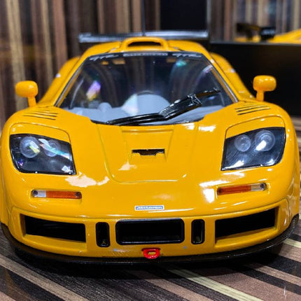 Solido McLaren F1 GTR Short-Tail 1:18 Yellow Diecast Model Car - studio product photo of the scale model